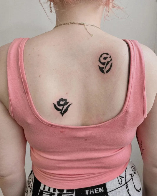 Small Negative Space YinYang Rose Tattoo on Women Back by @surreal.lines