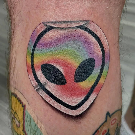 Small Neo Traditional Alien Head Tattoo on Men Knee by @amyrose.tattoo
