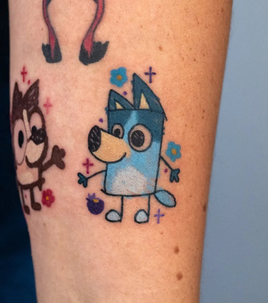 Small Neo Traditional Bluey and Bingo Cartoon Tattoo on Women Arm by @overeasy_tattoo