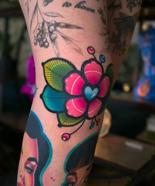 Small Neo Traditional Flower with Heart and Leaves on Women Thigh Tattoo by @tatarowatattoo