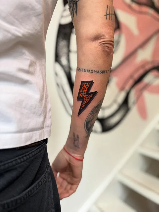 Small Neo Traditional Lightning Bolt Tattoo on Men Arm by @tamartielemantattoo