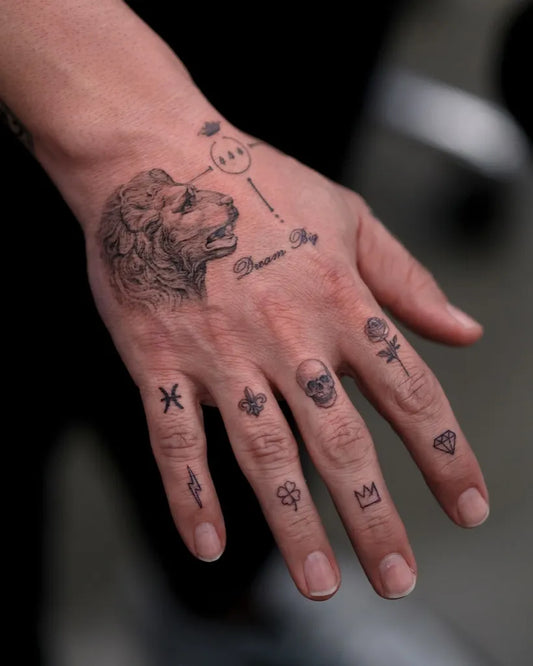 Small Neo Traditional Lion Skull Rose on Men Fingers Tattoo by @zeetattoo