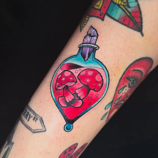 Small Neo Traditional Mushroom Potion Bottle on Women Arm Tattoo by @nekutattoos