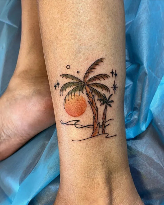 Small Neo Traditional Palm Tree Sun Waves Tattoo on Women Leg by @captain_tat2