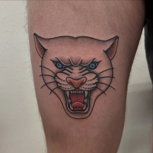 Small Neo Traditional Panther Head Tattoo on Men Thigh by @joshc.art