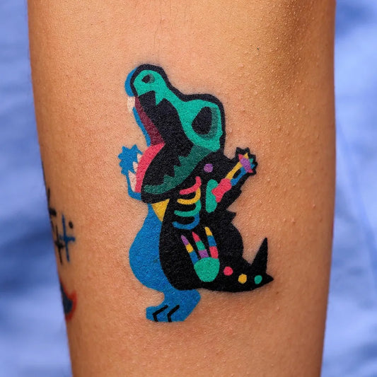 Small Neo Traditional Pokemon Crocodile Tattoo on Women Arm by @zzizziboy