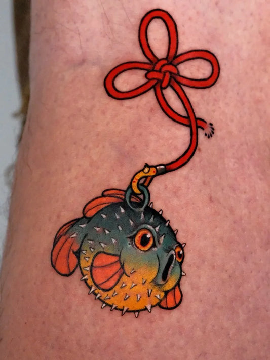 Small Neo Traditional Pufferfish with Red Cord on Men Arm Tattoo by @chen.tattooer