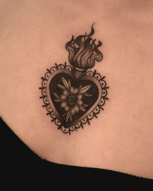 Small Neo Traditional Sacred Heart on Women Chest Tattoo by @theblackhattattoo