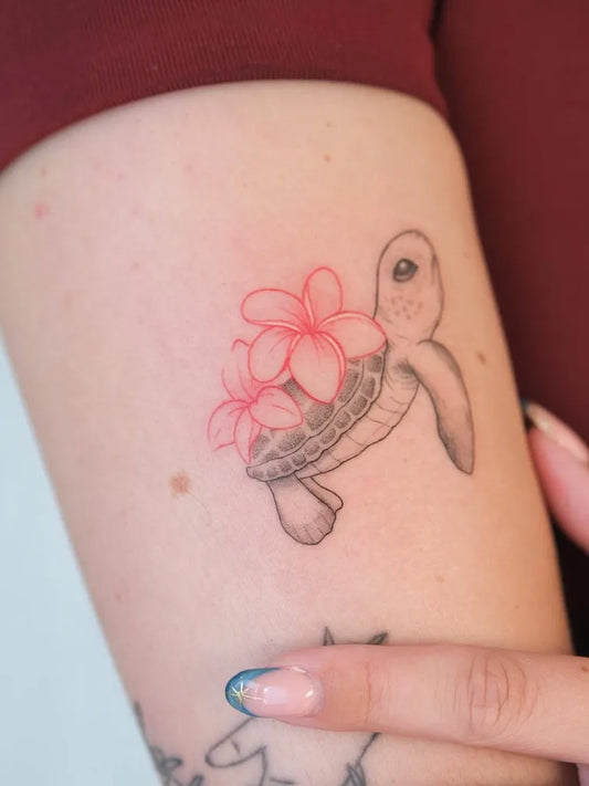 Small Neo Traditional Turtle and Hibiscus Tattoo on Women Arm by @thepeople.tattoo