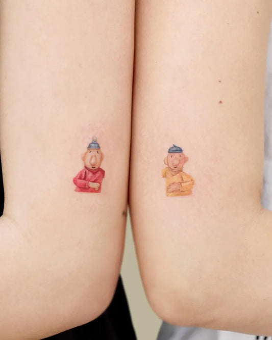 Small Neo Traditional Two Cartoon Characters Tattoo on Women Arms by @tattoo.pencil