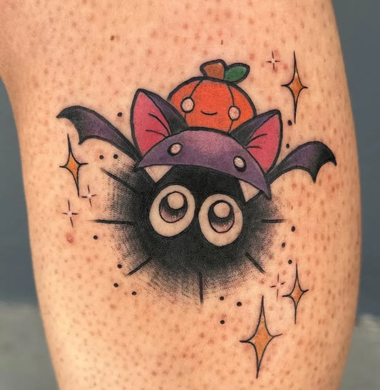 Small Neotraditional Bat Pumpkin Halloween Tattoo on Women Arm by @ktrantattoos