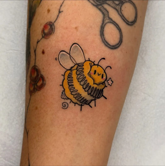 Small Neotraditional Bee on Women Arm Tattoo by @giro.ink