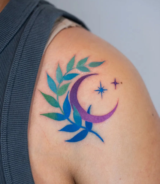Small Neotraditional Crescent Moon Laurel Stars Tattoo on Women Shoulder by @heeyajenny