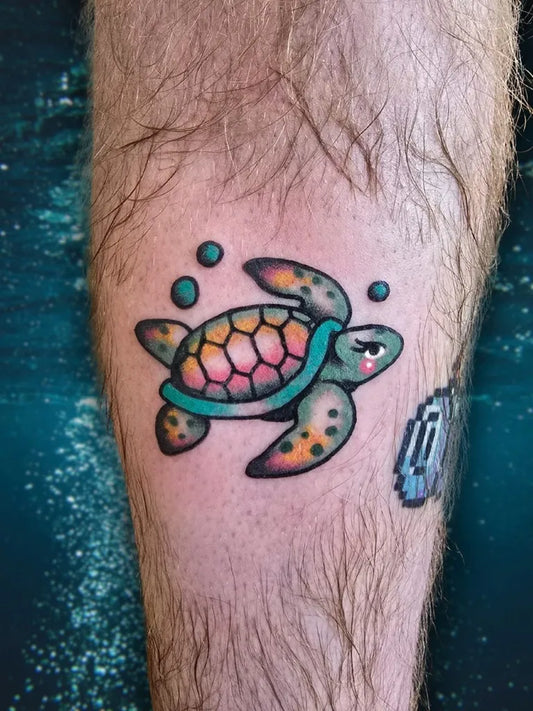 Small Neotraditional Cute Turtle with Bubbles Tattoo on Men Leg by @crucibletattooco