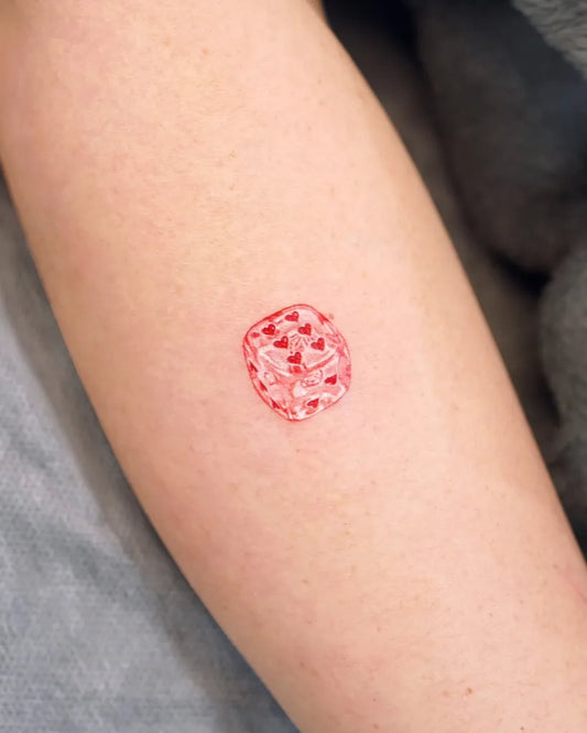 Small Neotraditional Dice Tattoo on Women Arm by @eins_tattooer