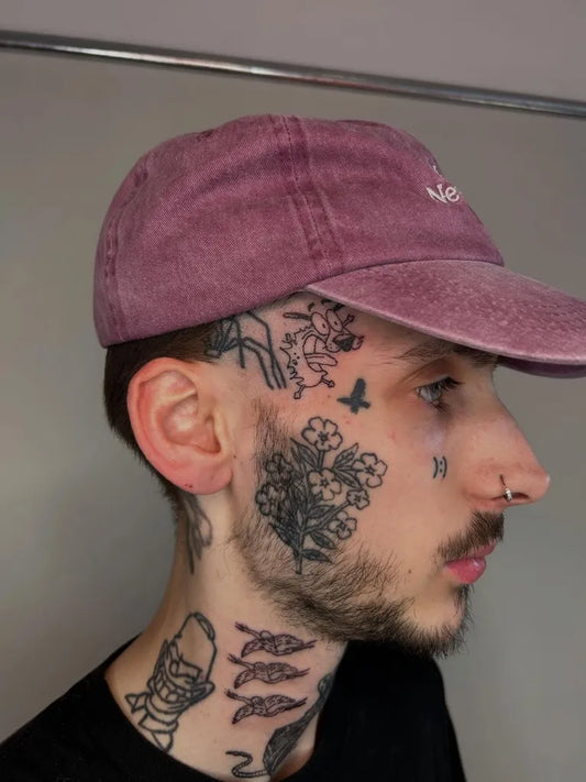 Small Neotraditional Flowers Bird on Men Face Tattoo by @adverse.camber
