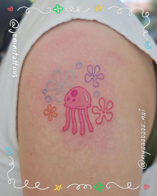 Small Neotraditional Jellyfish Flowers Tattoo on Women Shoulder by @jeninitattoos