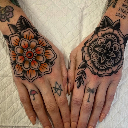 Small Neotraditional Mandala Flowers and Symbols on Women Hands Tattoo by @hannahsteyntattoo