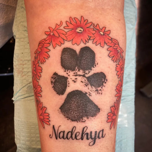 Small Neotraditional Pawprint Flower Garland with Name on Women Arm Tattoo by @magicpawstattoo