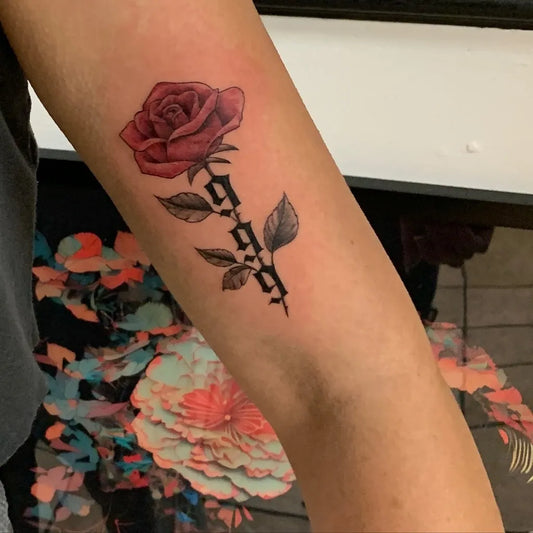 Small Neotraditional Rose with 999 on Women Arm Tattoo by @angeltattootampa