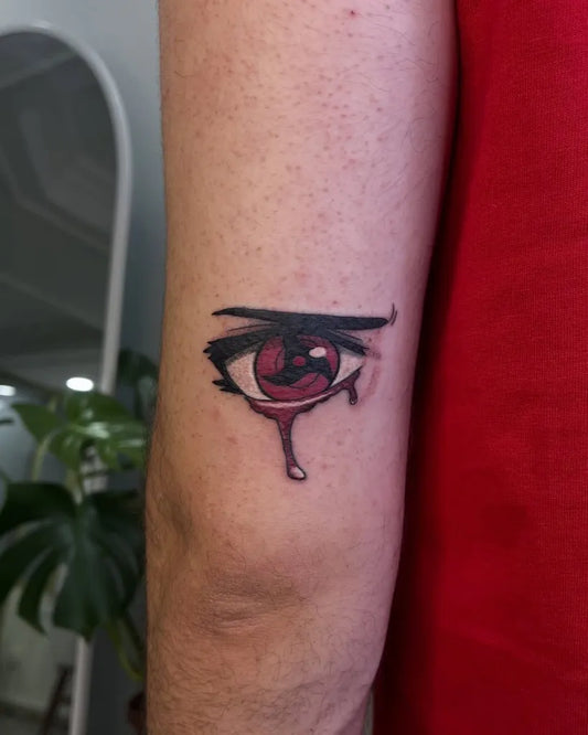 Small Neotraditional SharinganEye on Men Arm Tattoo by @aysimakavas