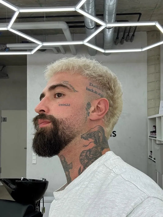 Small Neotraditional Snake Word on Men Face Tattoo by @serkanmichaelmorris
