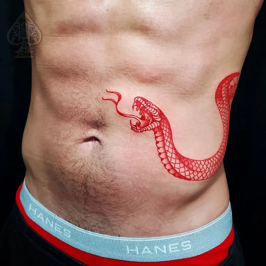 Small Neotraditional Snake on Men Abs Tattoo by @tatt_by_ajay