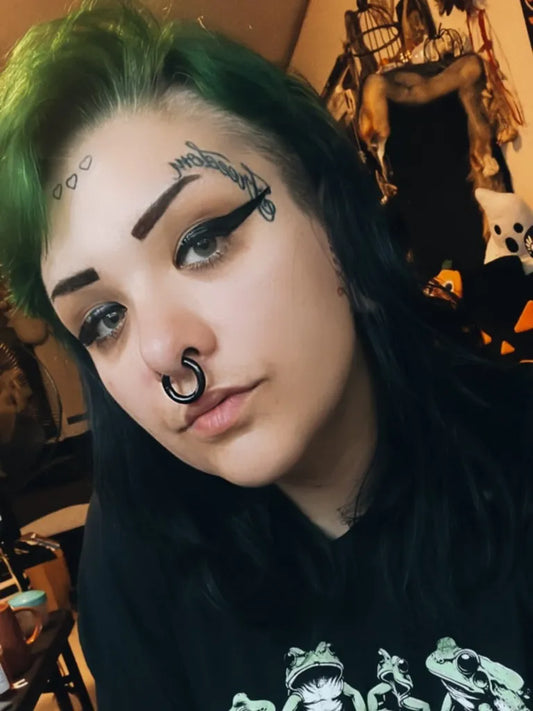 Small Neotribal Dragon on Women Face Tattoo by @garbage.ghoul