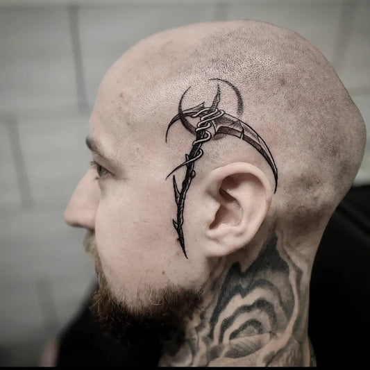 Small Neotribal Sickle on Men Face Tattoo by @ivanz_tattoo