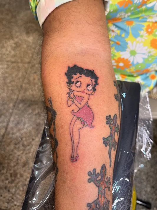 Small New School Betty Boop Cartoon Tattoo on Women Arm by @buccaneertattoo