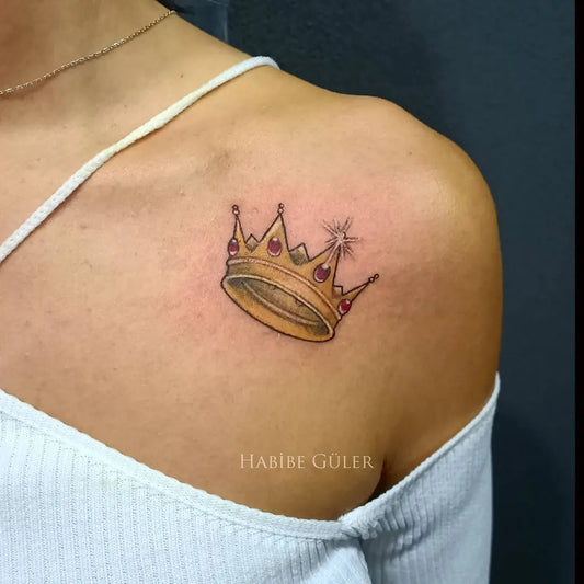 Small New School Crown Tattoo on Women Shoulder by @ha_ink_tattoo