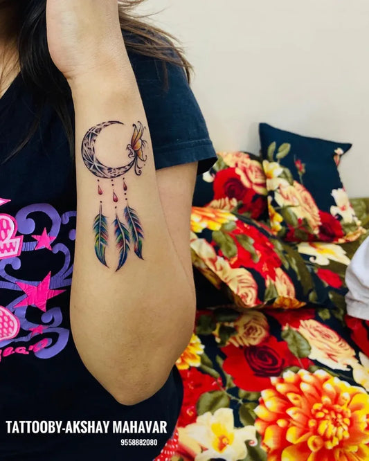 Small New School Dream Catcher with Moon and Feathers Tattoo on Women Forearm by @akshay_88866