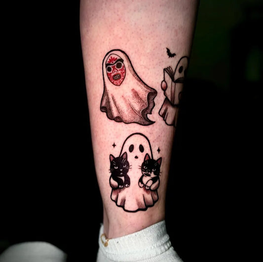 Small New School Ghost Cats Tattoo on Women Leg by @zeliatattoo