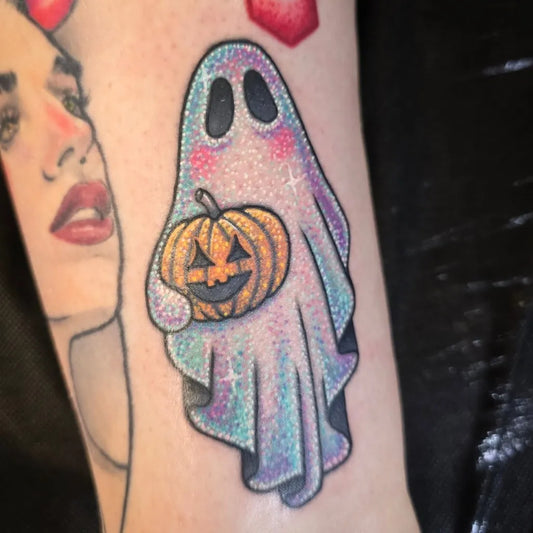 Small New School Ghost with Pumpkin Tattoo on Women Arm by @molly.tattoos