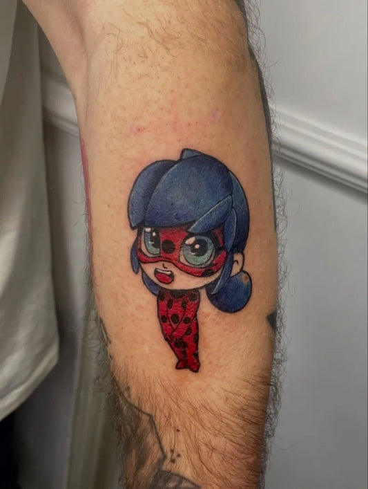 Small New School Ladybug Chibi Tattoo on Men Arm by @michelaolivatattoo