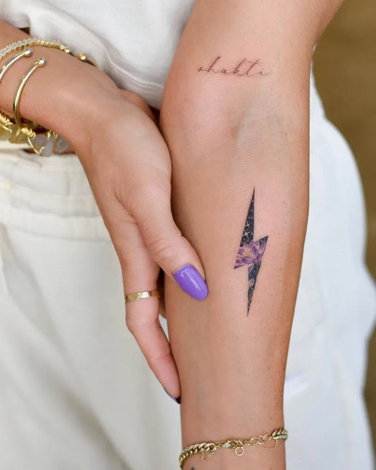 Small New School Lightning Bolt Tattoo on Women Forearm by @bryan