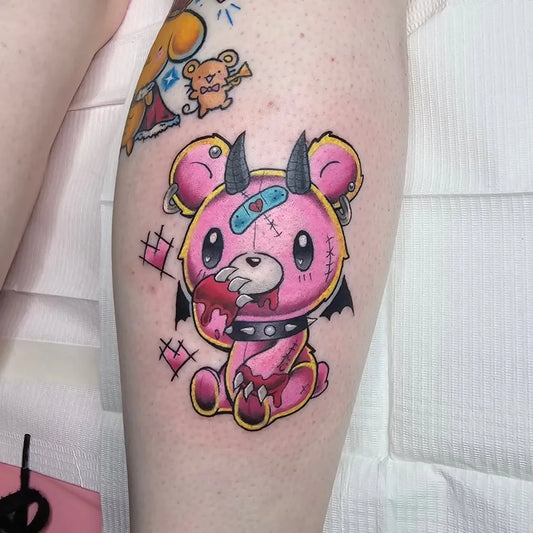 Small New School Pink Devil Bear on Women Thigh Tattoo by @buhberri_art