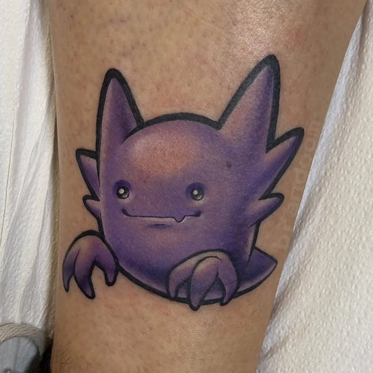 Small New School Pokemon Umbreon Tattoo on Women Leg by @pokemon.tatts