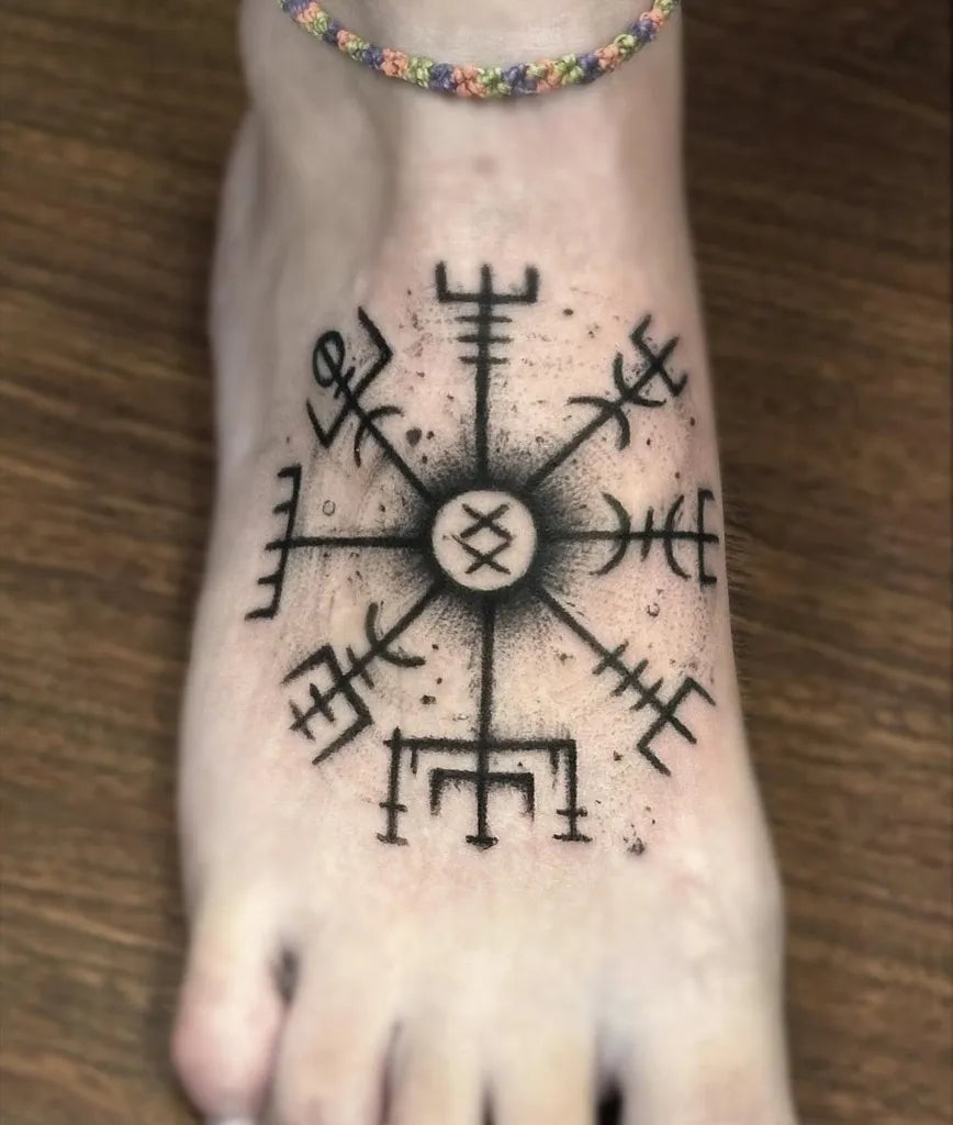 Small Nordic Vegvisir Tattoo on Women Foot by @daniela.moreno.l
