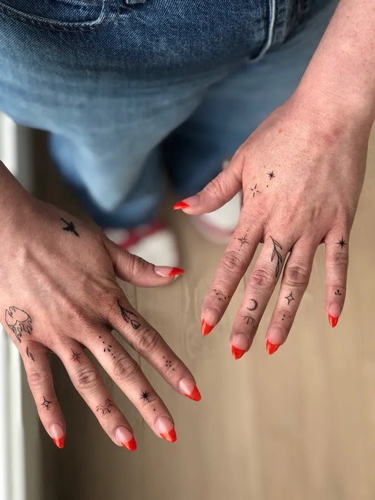 Small Occult Symbols on Women Fingers Tattoo by @leila.oko