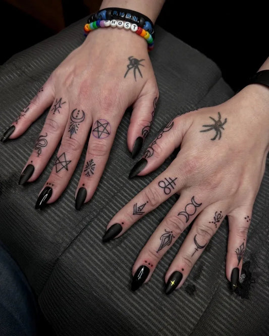 Small Occult Symbols on Women Fingers Tattoo by @saltyflamingotattoo