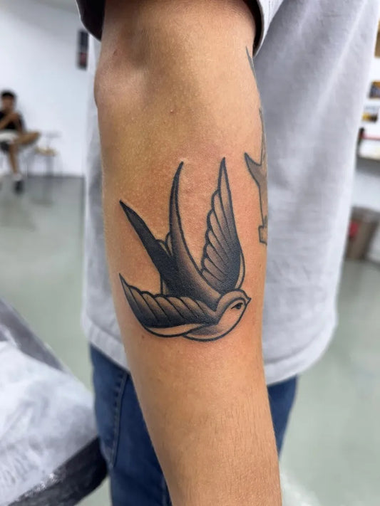 Small Old School Swallow Tattoo on Men Arm by @dhemafugi