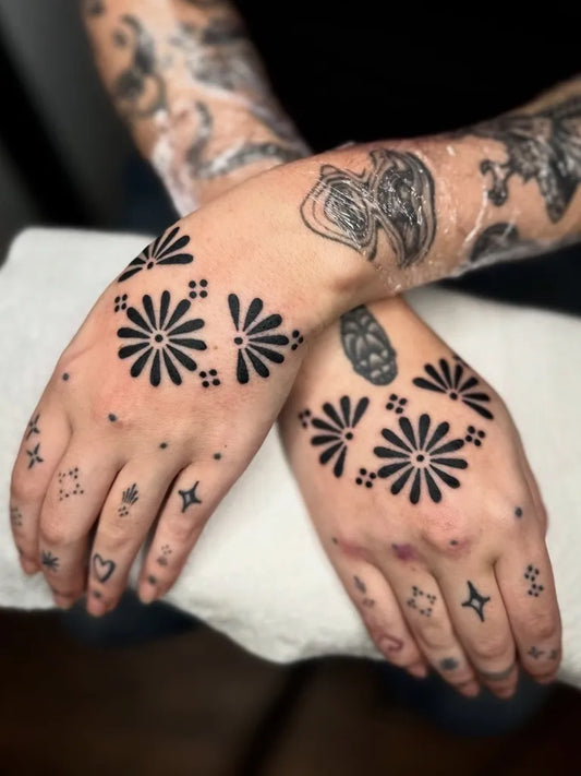 Small Ornamental Dahlia Flowers Tattoo on Women Hands by @tats_by_hats