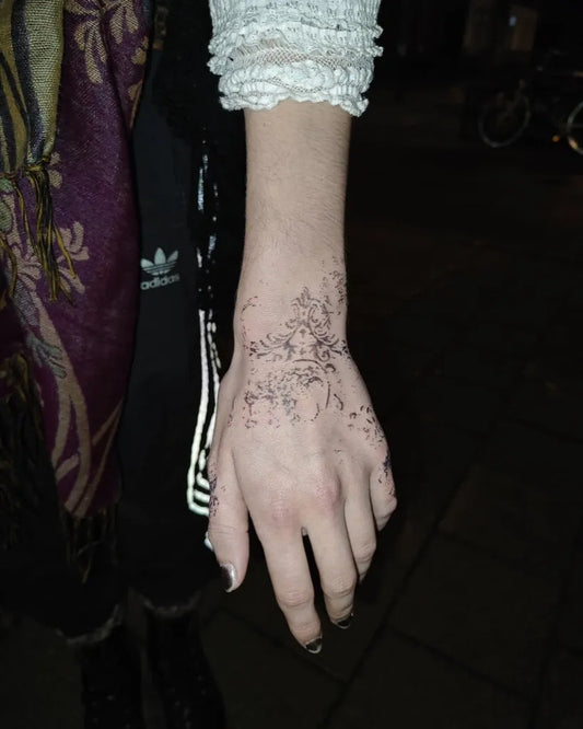 Small Ornamental Fine Line Flowers Tattoo on Women Wrist by @666bloodandtears69