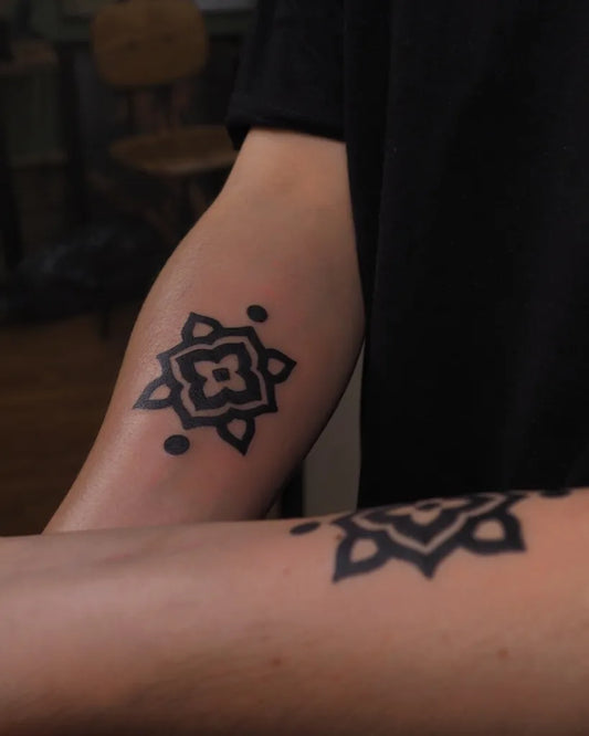 Small Ornamental Floral Motif Tattoo on Men Arm by @lilentatt