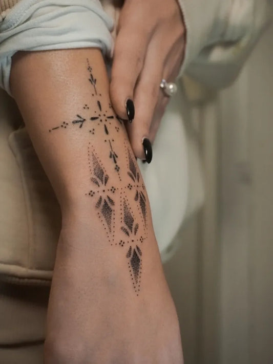 Small Ornamental Geometric Cross Tattoo on Women Wrist by @nikytattooer