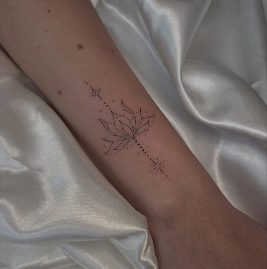Small Ornamental Lotus Flowers and Stars Tattoo on Women Forearm by @albertosoler.ink