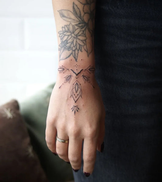 Small Ornamental Mandala Flowers Tattoo on Women Wrist by @jadejay.ink