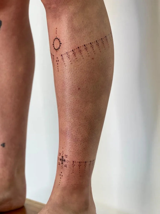 Small Ornamental SunDotsLines Tattoo on Women Leg by @viking.celtic.tattoo