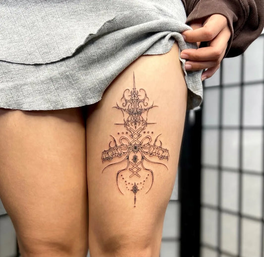 Small Ornate Mandala on Women Thigh Tattoo by @kinamay.ink